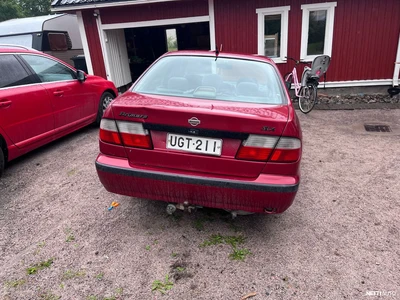 Nissan Primera 1997, photo 3/8